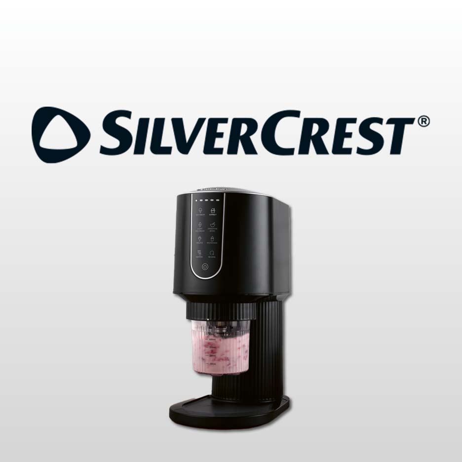 Black ice cream maker with a clear container of pink ice cream, on a grey background.